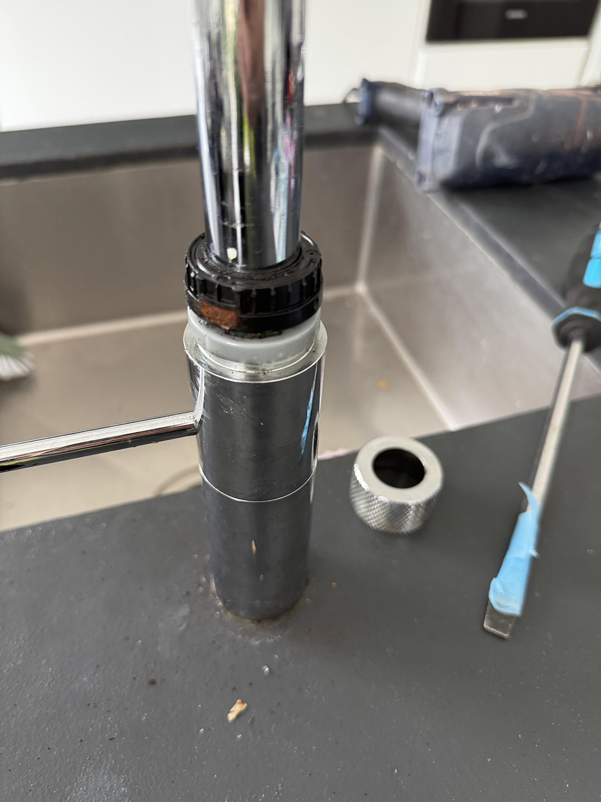Once the metal cover is removed, the damaged magnet is visible