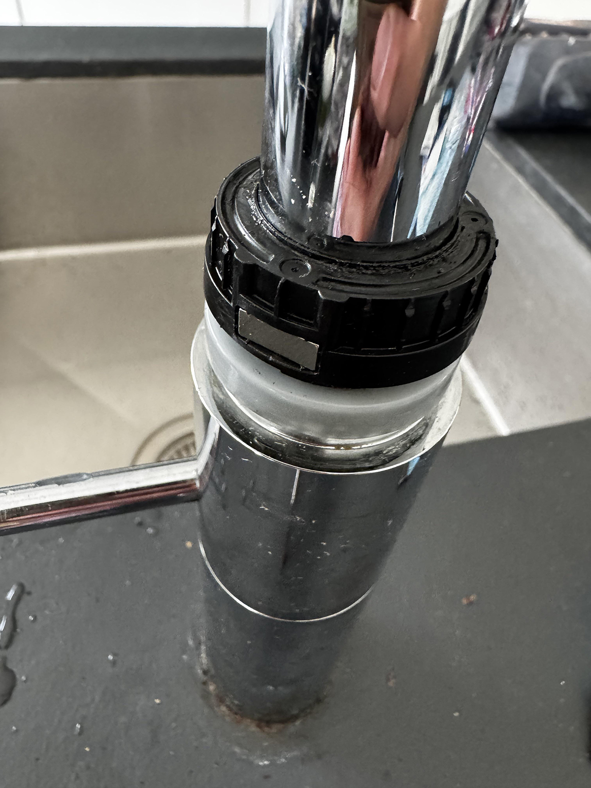 The new 10 × 4 × 1 mm magnet fitted in place of the old magnet