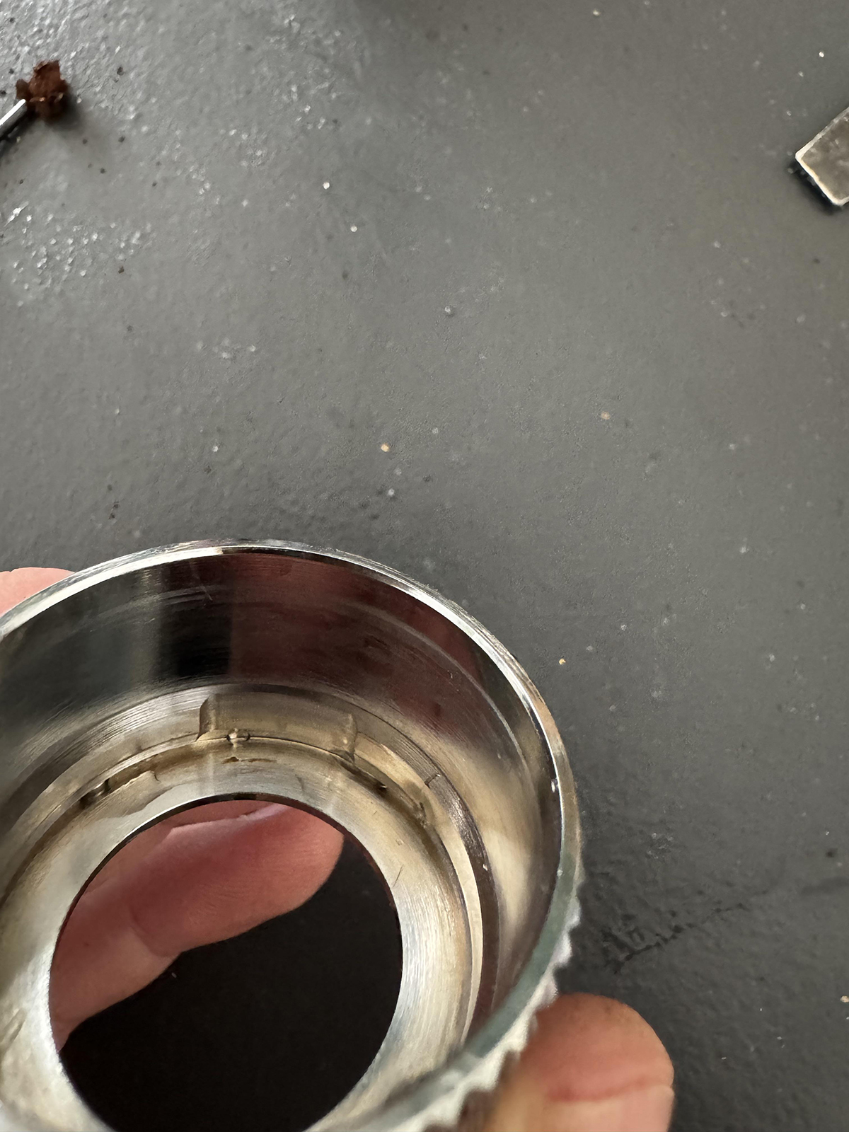 Note the two indentations inside the metal cover. These must line up with the magnet.